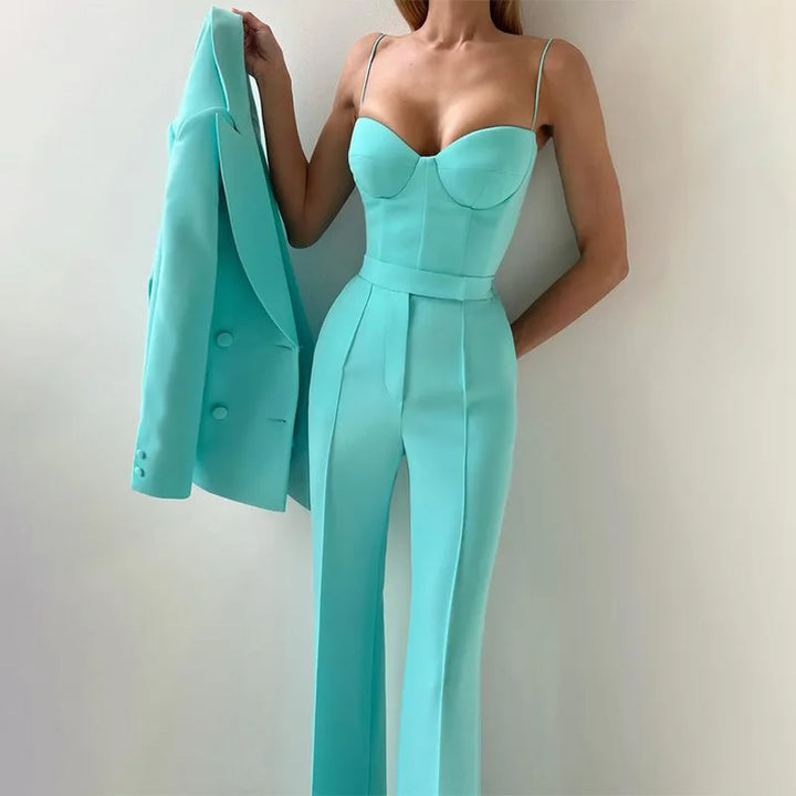 Emerald bustier top with matching trousers and blazer held over arm