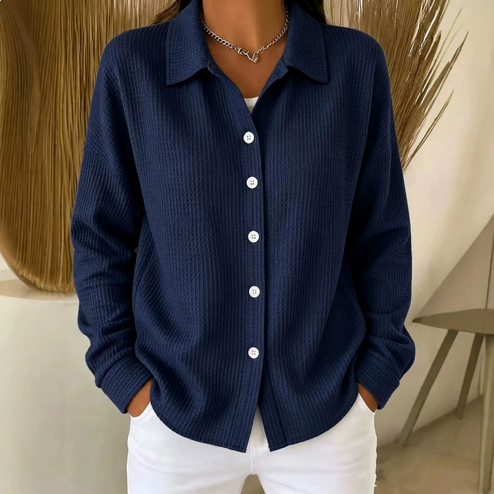 Woman wearing navy waffle knit button-front shirt