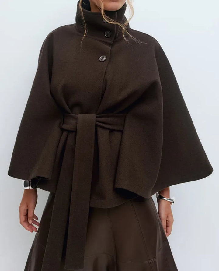 Close-up of dark brown cape jacket collar and belted waist