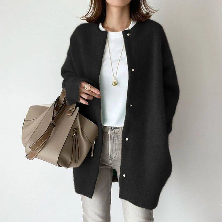 Black oversized knit cardigan with crew neck and snap buttons