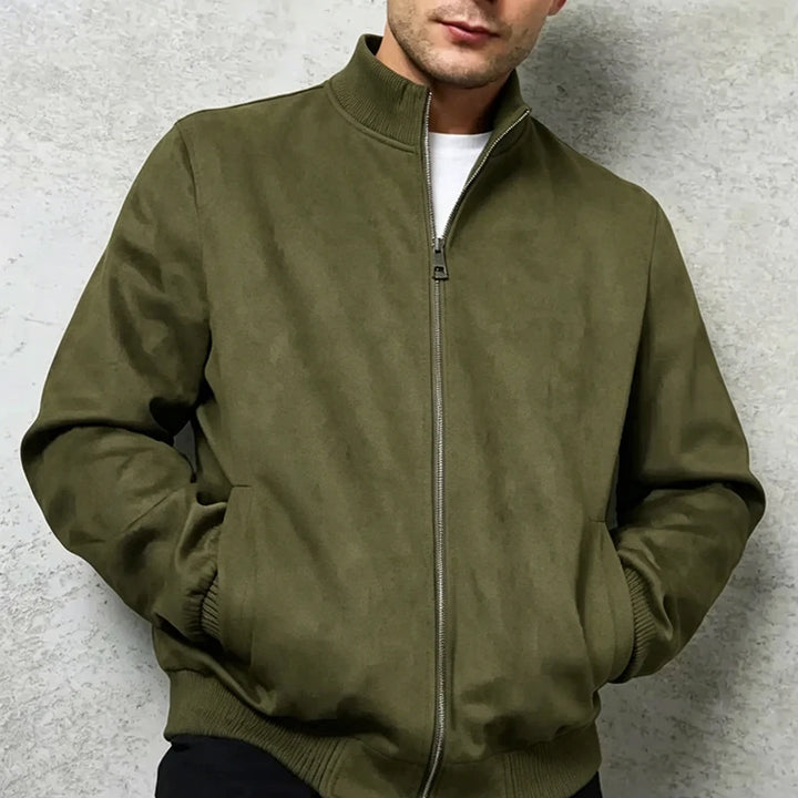 Man wearing green suede bomber jacket close up view