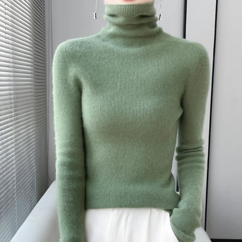 Woman wearing sage green ribbed turtleneck sweater