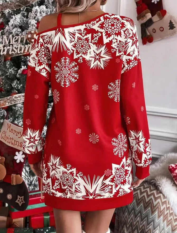 Back view of red snowflake print mini dress with cold shoulder detail