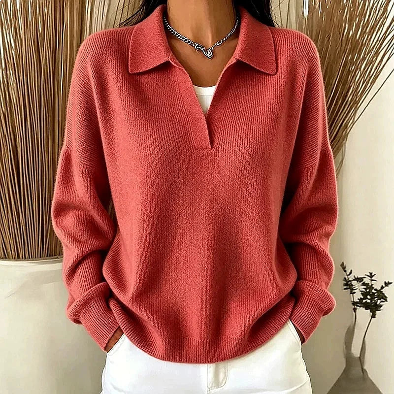 Woman wearing rouge red ribbed knit polo sweater with deep V neckline