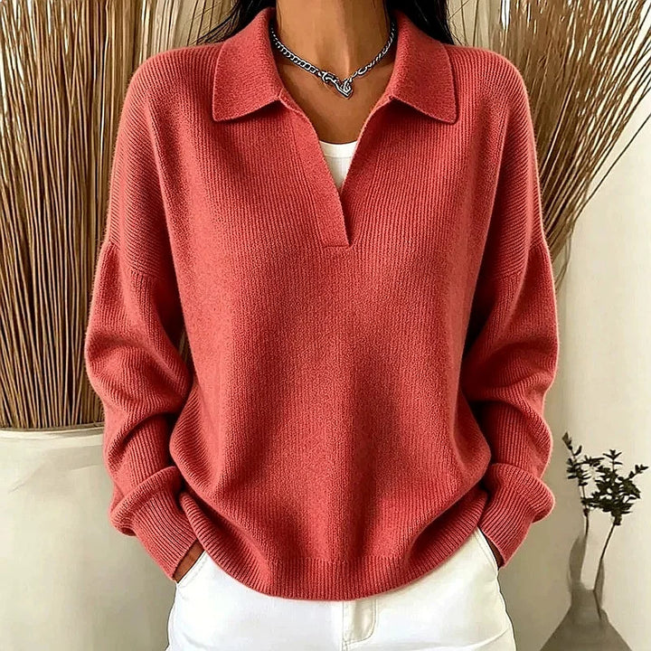 Woman wearing rouge red ribbed knit polo sweater with deep V neckline