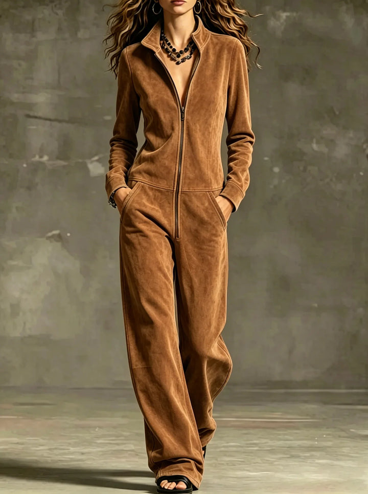 Model wearing dark brown front zip wide leg jumpsuit, front view
