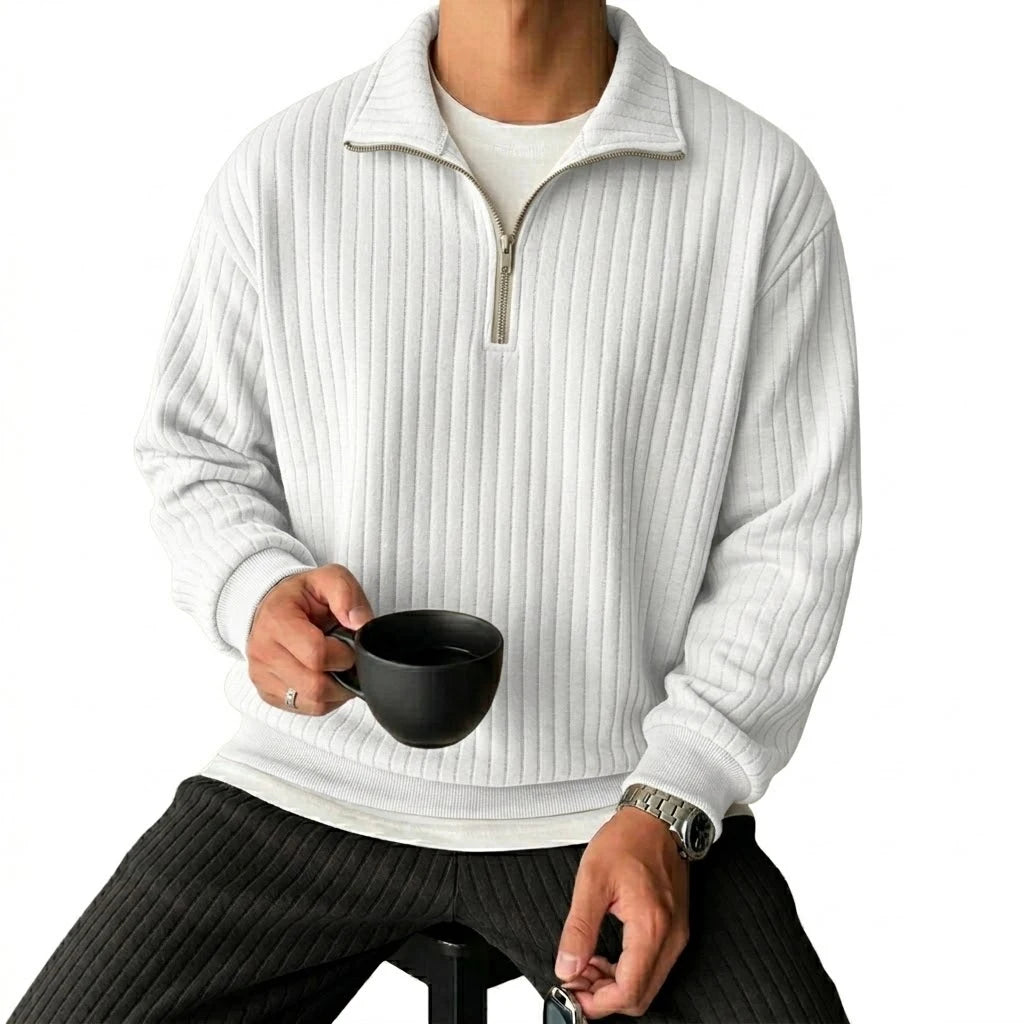 Man wearing white ribbed quarter-zip pullover, front view