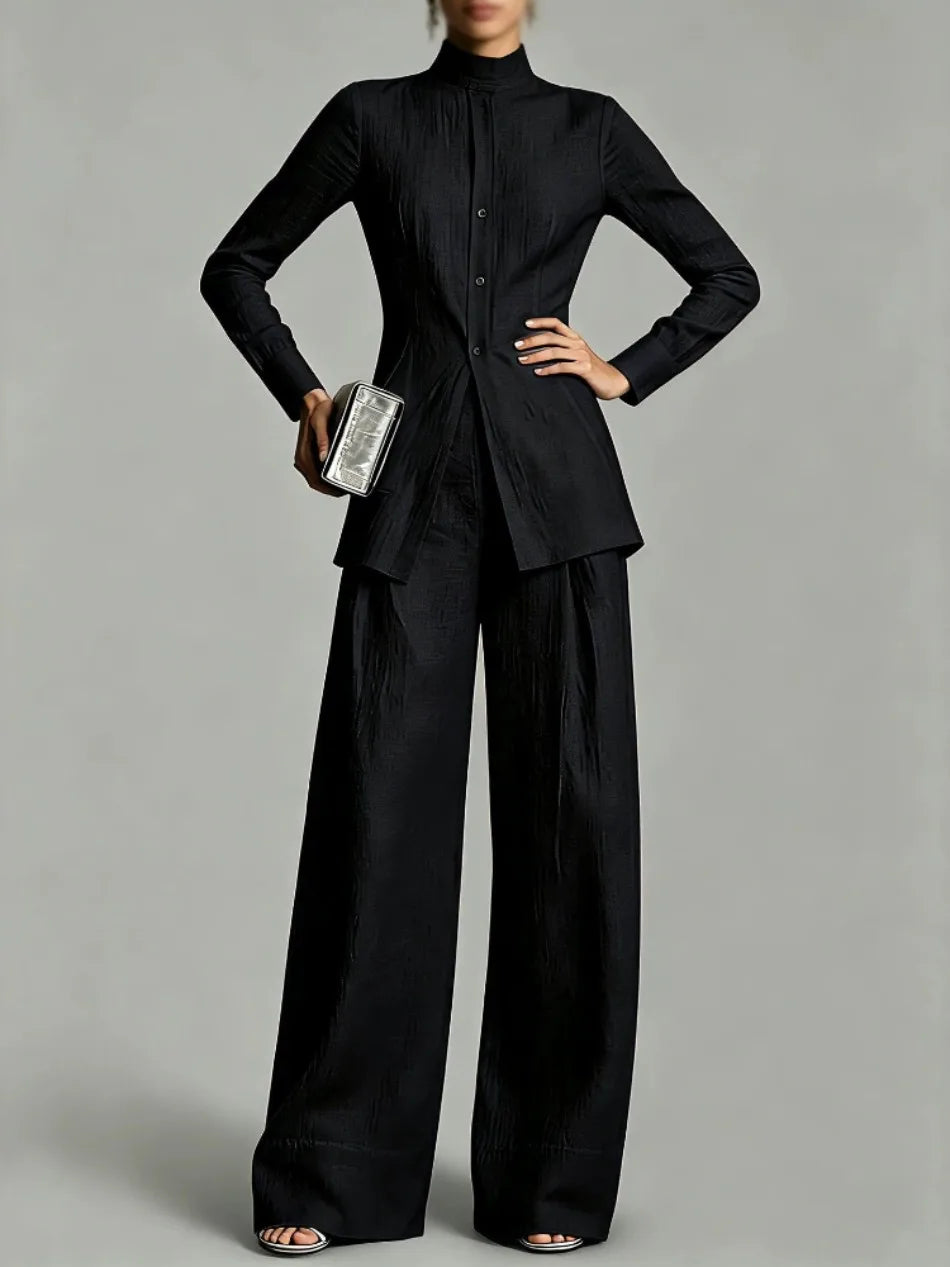 Woman wearing black mock neck top and wide leg pants set, front view