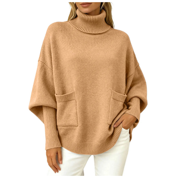 Woman wearing camel oversized turtleneck sweater with front pockets
