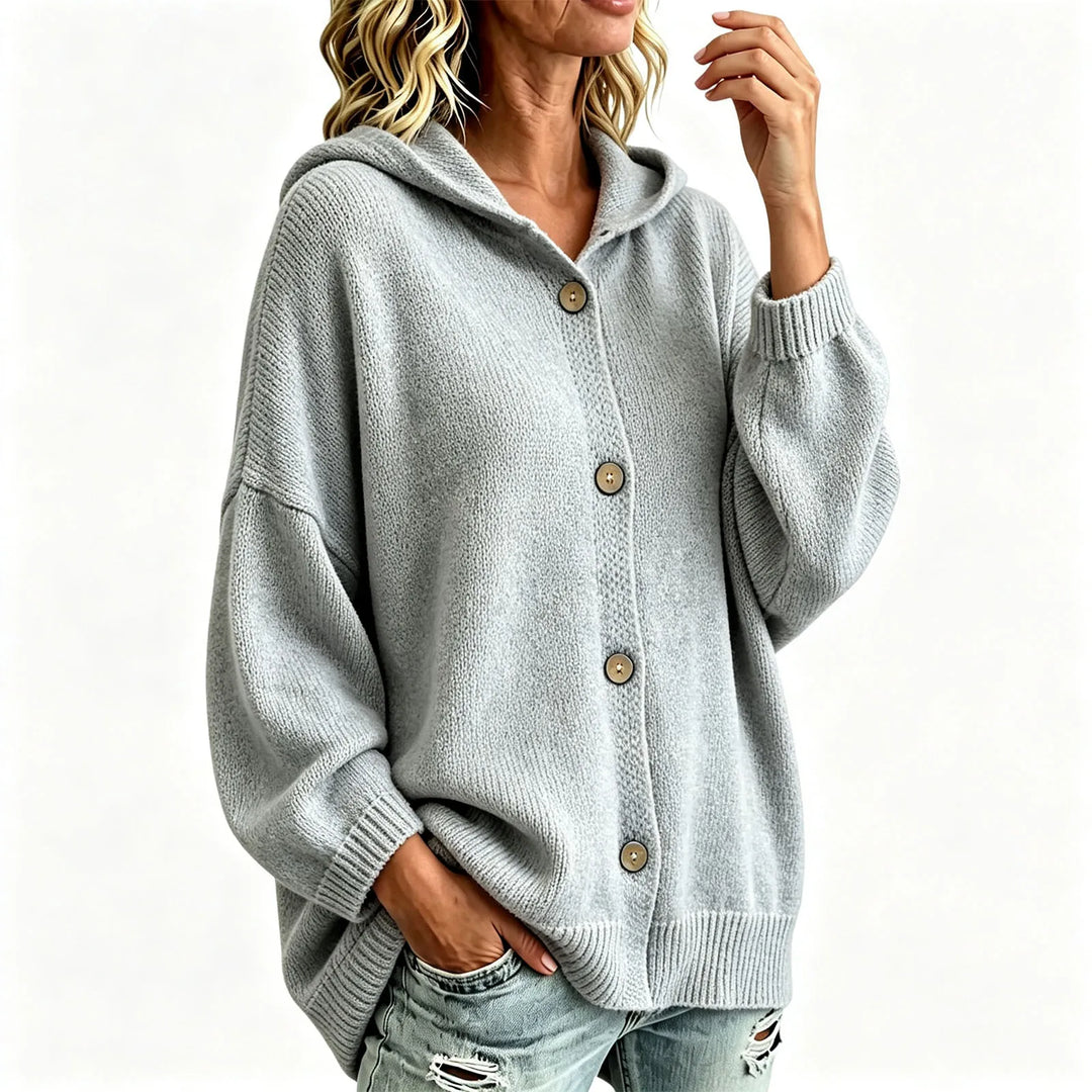 Grey hooded button front cardigan on model against plain background