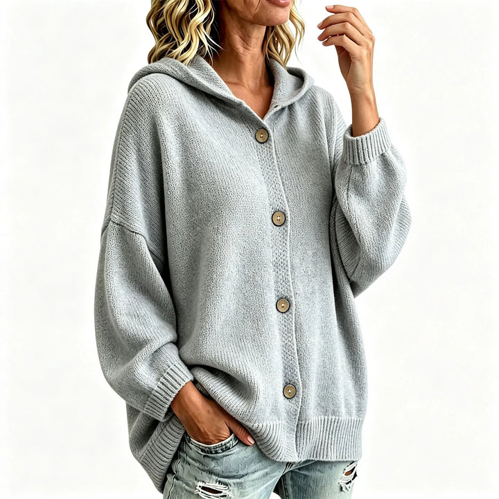 Grey hooded button front cardigan on model against plain background