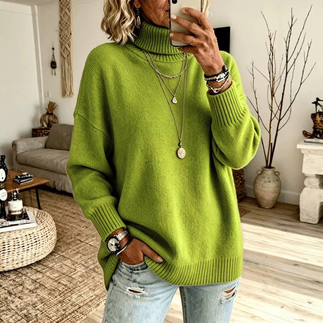 Woman wearing green oversized turtleneck sweater