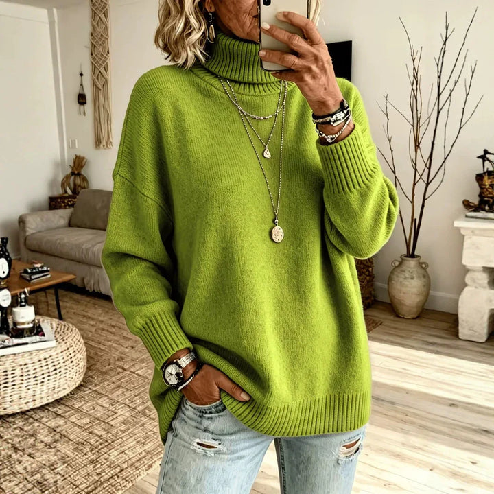 Woman wearing green oversized turtleneck sweater