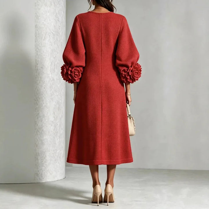 Back view of red knit midi dress with floral cuffs
