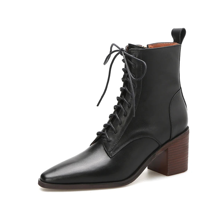 Black leather ankle boot angled studio shot