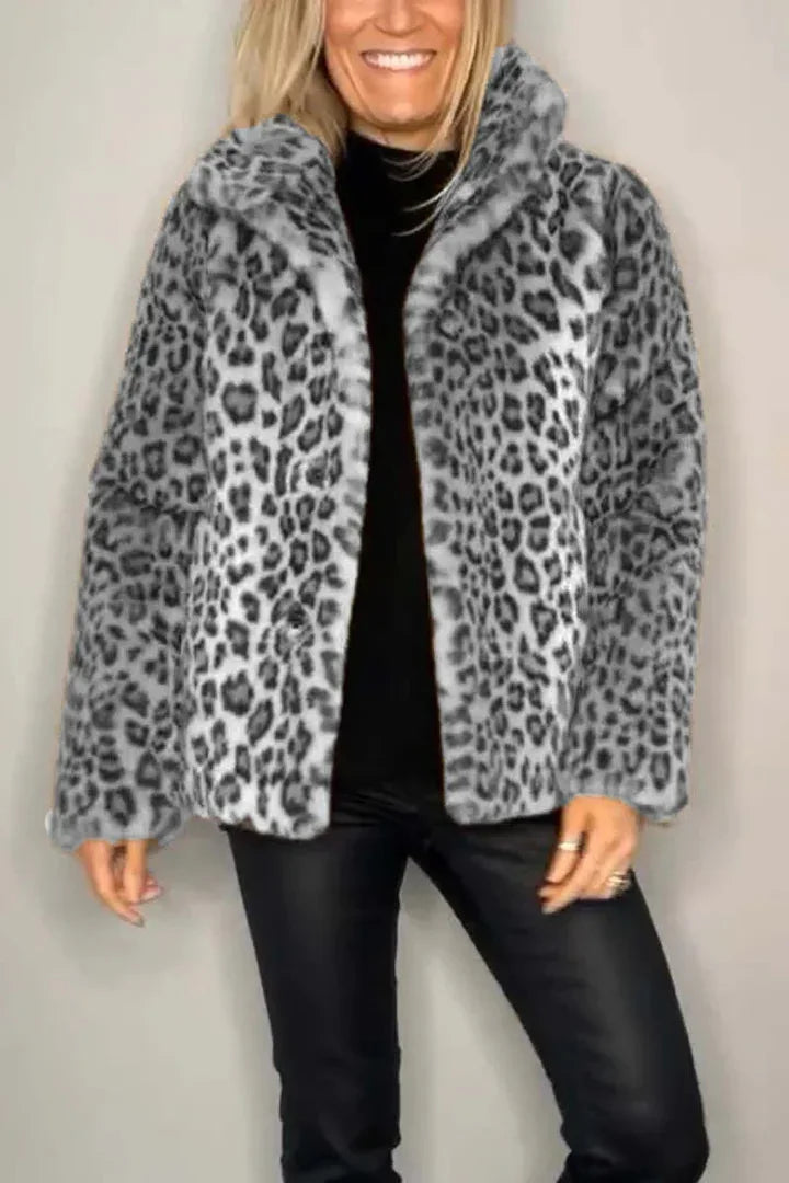 Model wearing gray leopard print faux fur coat, front view