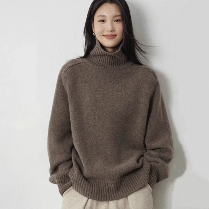 Woman wearing brown oversized turtleneck wool sweater