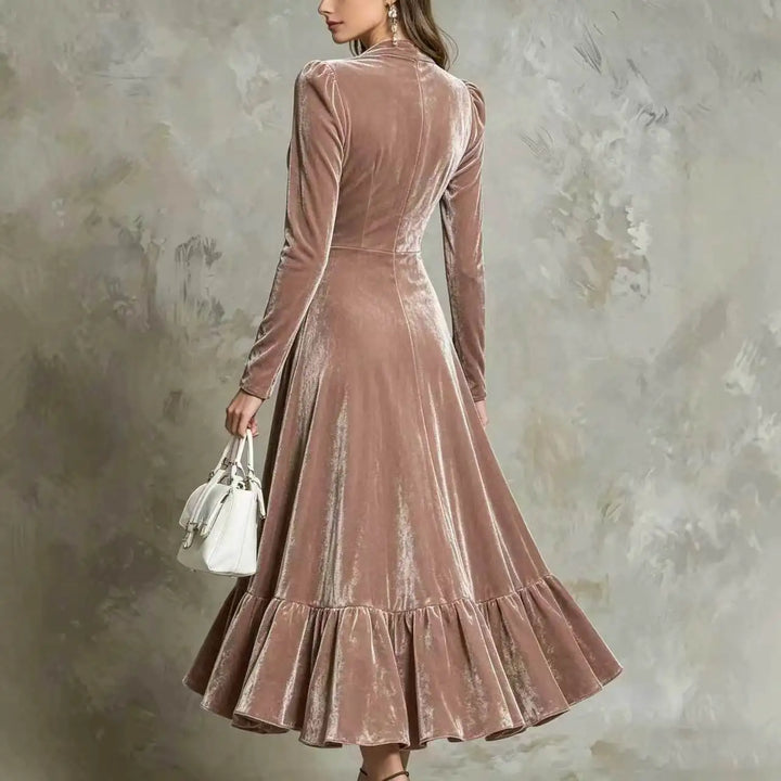 Back view of pink velvet midi dress with ruffled hem