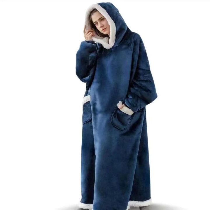 Woman wearing blue hooded wearable blanket with front pockets