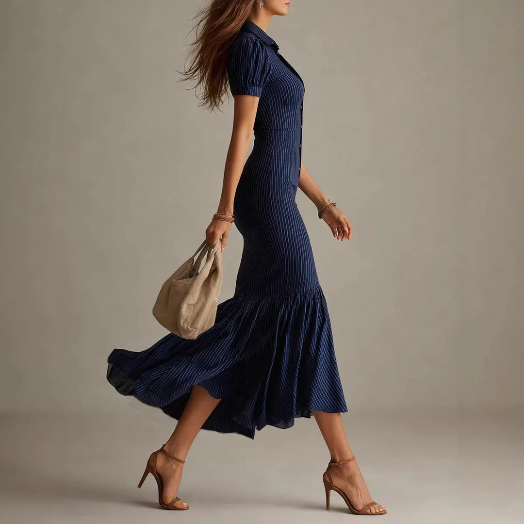 Side view of navy blue pinstripe mermaid midi dress