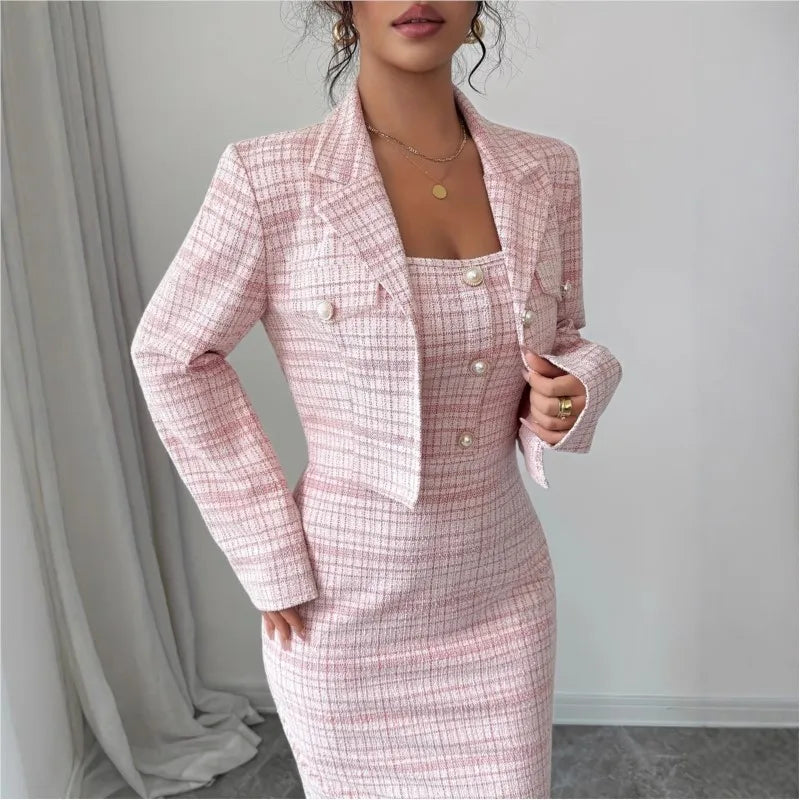Close up of pink tweed jacket and dress with pearl buttons