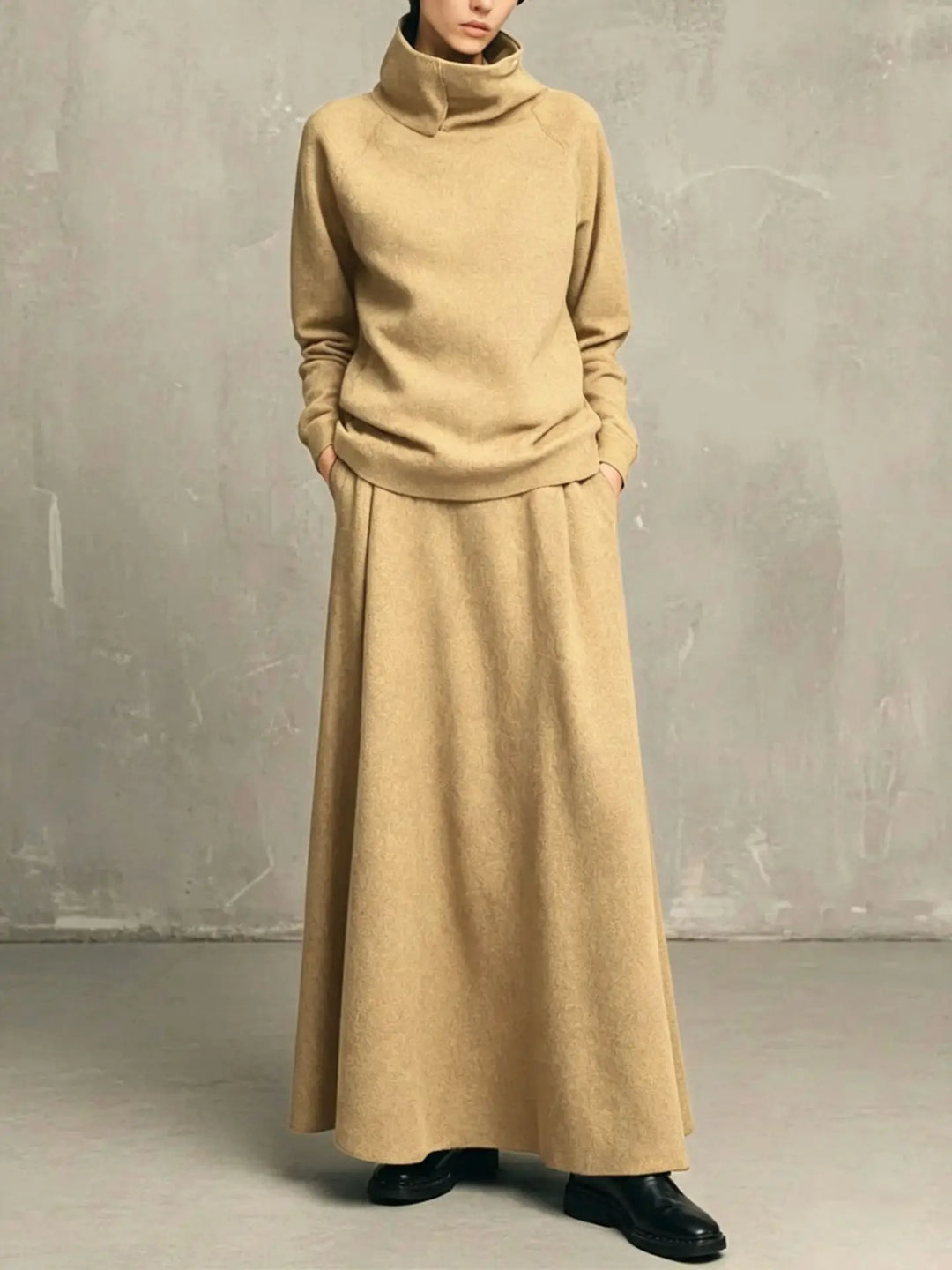 Woman wearing khaki funnel neck sweatshirt and matching maxi skirt set