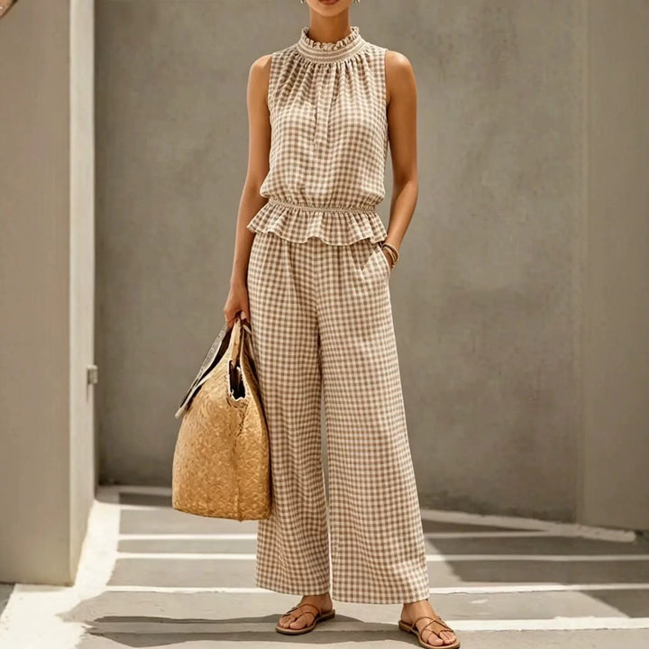 Woman wearing khaki gingham peplum top and wide leg pants set