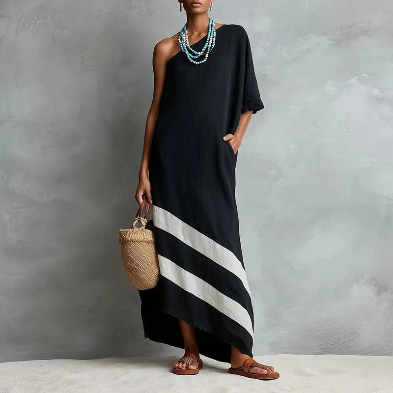 Black one-shoulder maxi dress with diagonal stripe hem, front view