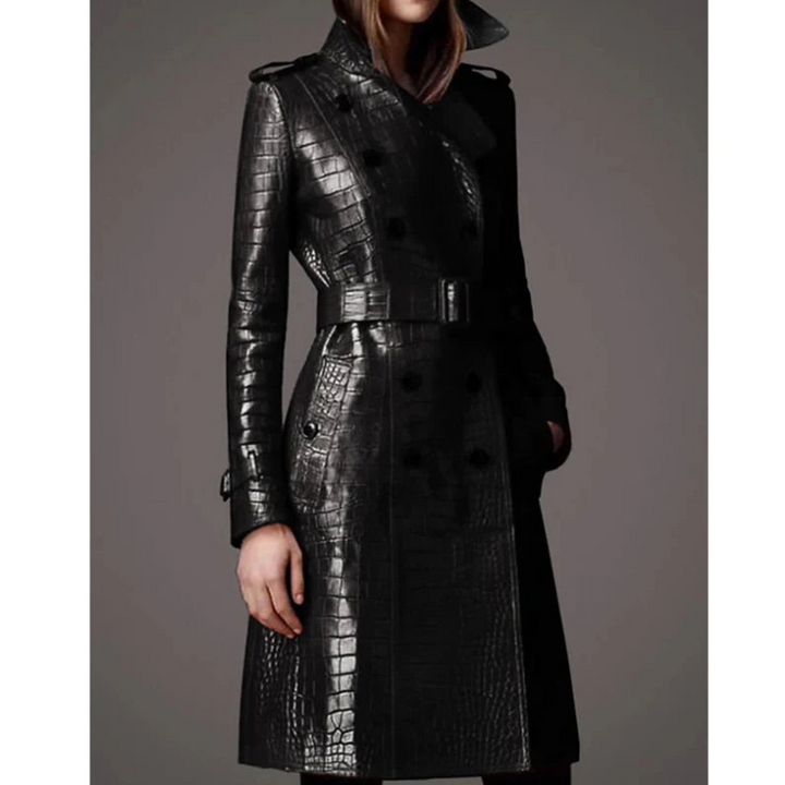 Woman wearing black crocodile print leather trench coat, front view