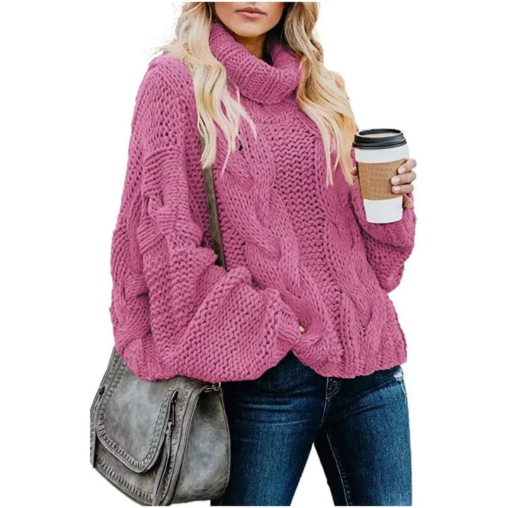 Woman wearing rose red chunky cable knit turtleneck sweater