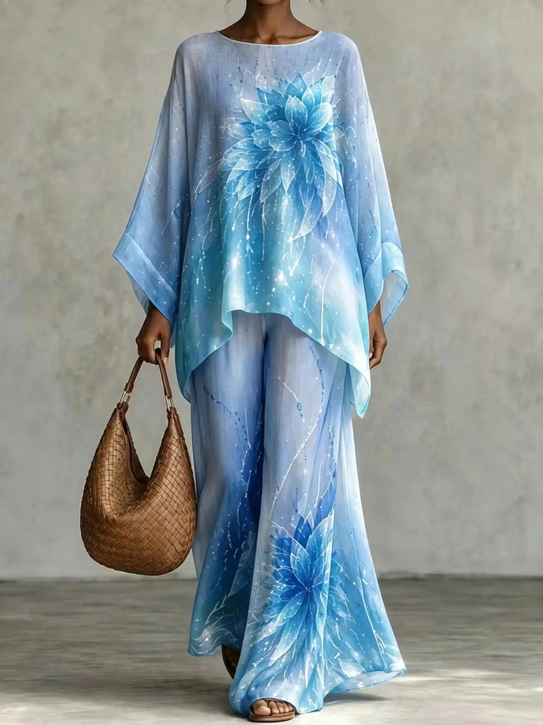 Woman wearing sky blue floral print batwing sleeve top and wide leg pants set