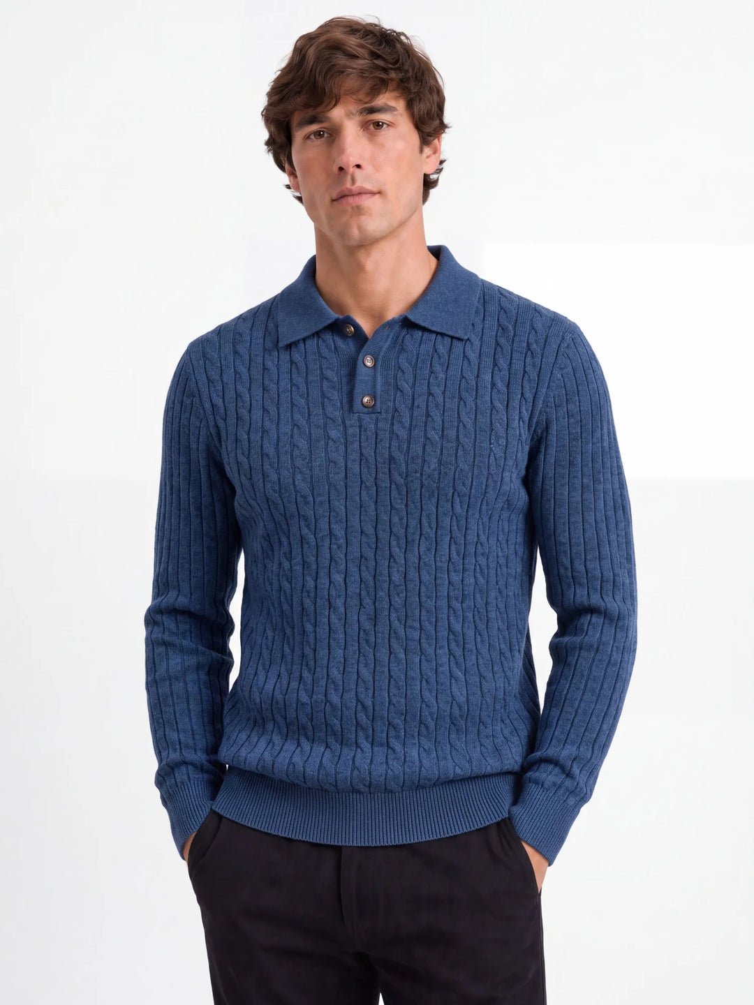 Man wearing blue cable knit polo sweater