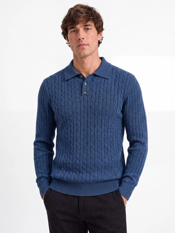 Man wearing blue cable knit polo sweater