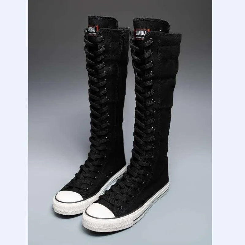 Black knee-high lace-up canvas boots, front angled view
