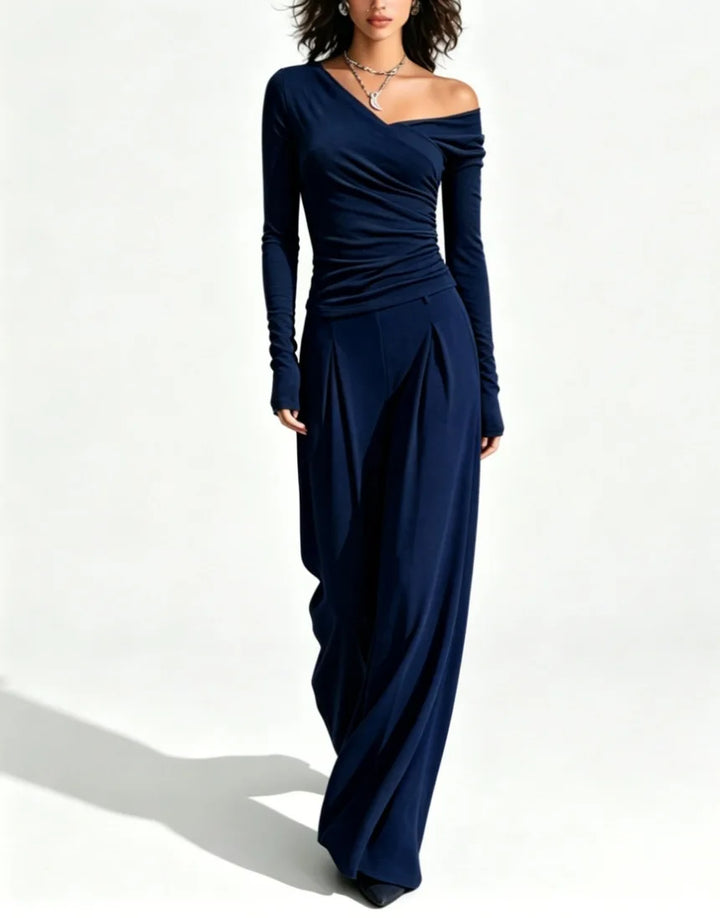 Woman wearing navy blue off shoulder top and wide leg pant set