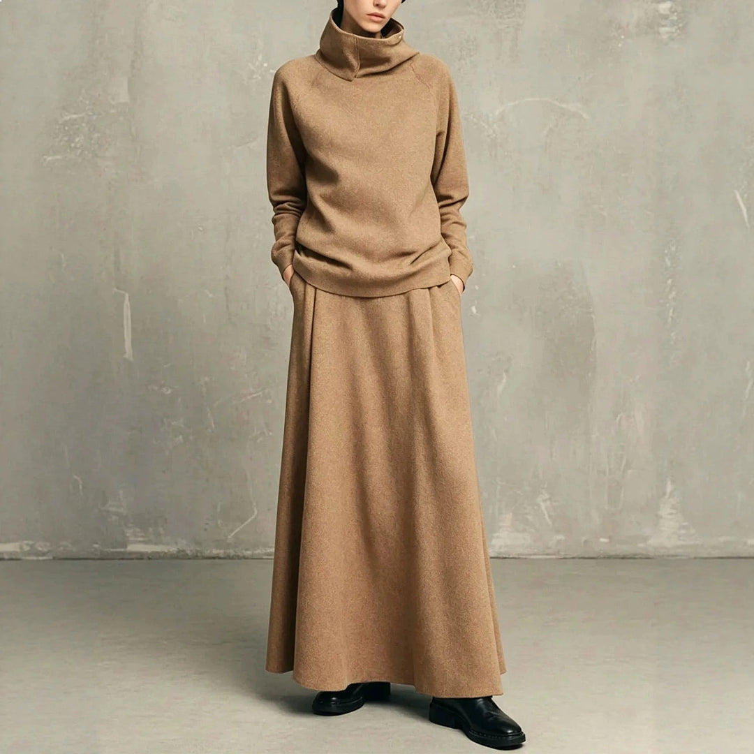 Woman wearing camel funnel neck sweatshirt and matching maxi skirt set