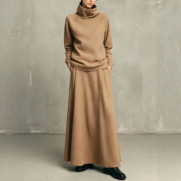 Woman wearing camel funnel neck sweatshirt and matching maxi skirt set