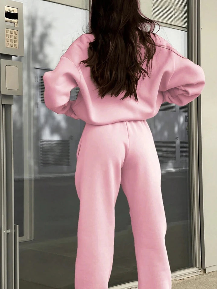 Back view of pink half-zip tracksuit set