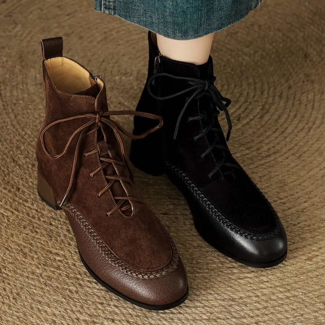 Brown and black suede lace-up ankle boots side by side on model