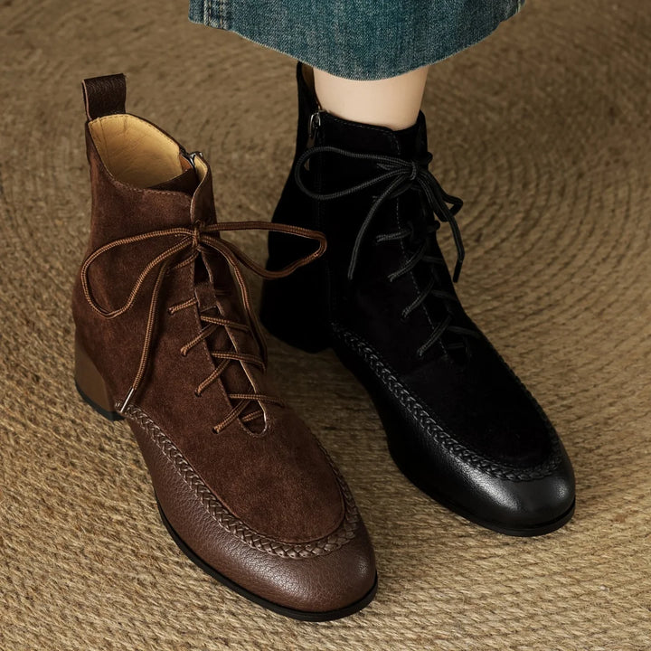 Brown and black suede lace-up ankle boots side by side on model