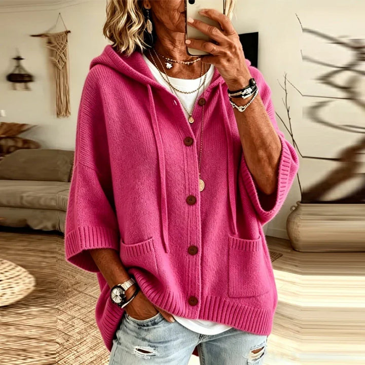 Woman wearing hot pink hooded button-front cardigan