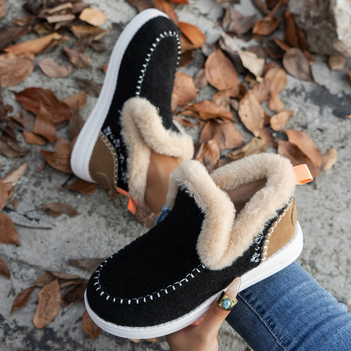 Black felt ankle boots with faux fur collar and tan heel panel
