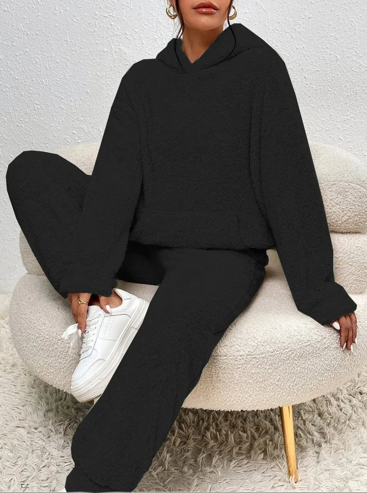 Woman wearing black brushed fleece hooded loungewear set