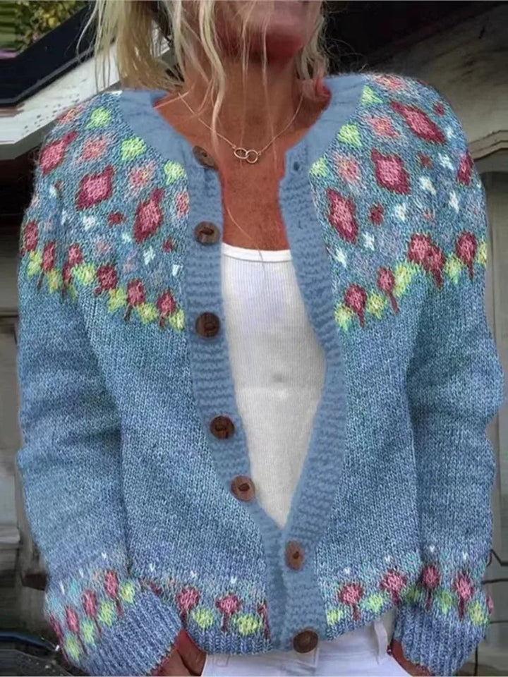Blue knit cardigan with floral patterned yoke