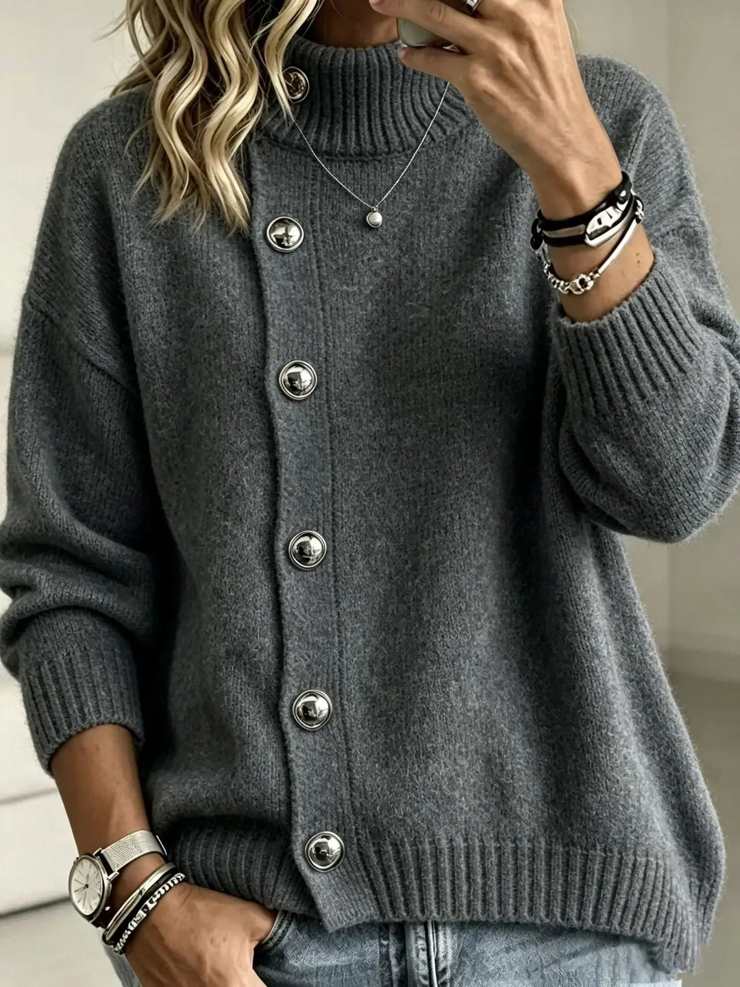 Woman wearing gray button front mock turtleneck sweater