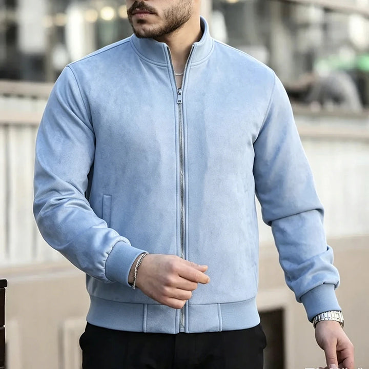 Man wearing light blue suede bomber jacket outdoors