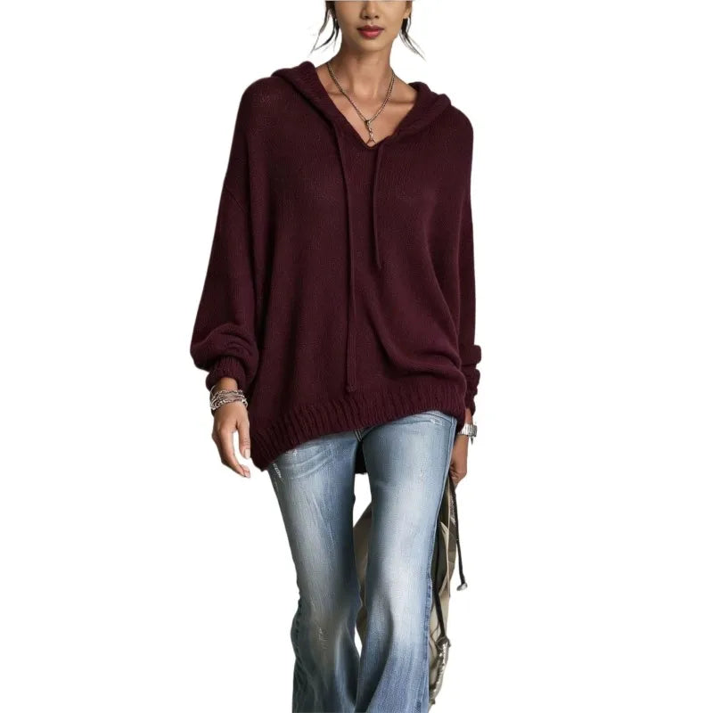 Woman wearing burgundy hooded knit sweater with drawstring neckline
