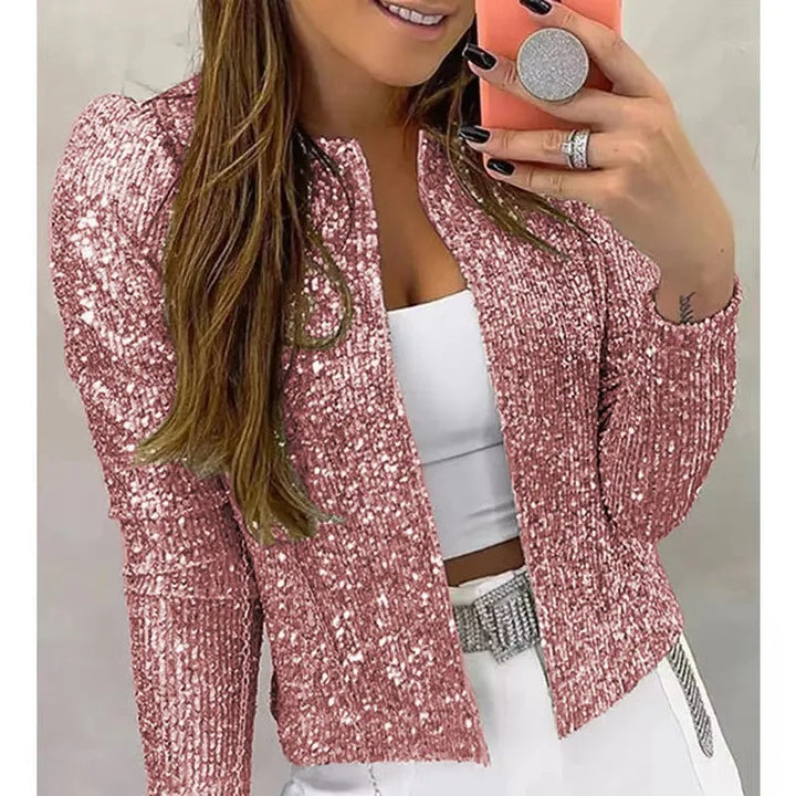Woman wearing pink sequin cropped jacket