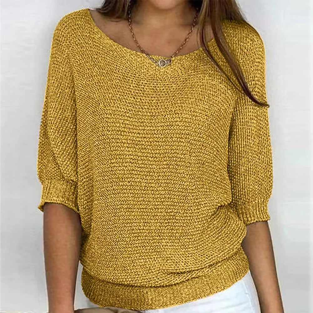 Mustard yellow knit top with scoop neckline and three-quarter batwing sleeves