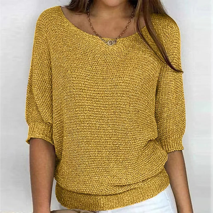 Mustard yellow knit top with scoop neckline and three-quarter batwing sleeves